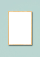 Wooden picture frame hanging on a light blue wall