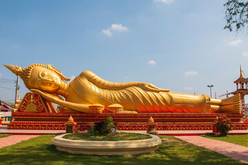 Fototapeta na wymiar Gold reclining Buddha in Phra that luang Temple at Vientiane, Laos
