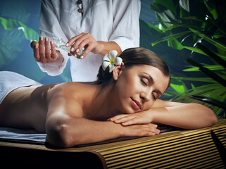 portrait of young beautiful woman in spa environment