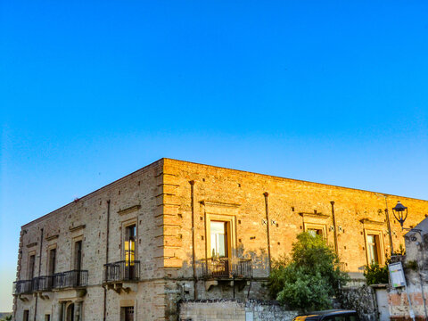 Street view in Bernalda at sundown, Matera district, Basilicata, Italy.