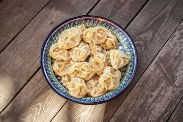 Ready-made manti in a national large plate.