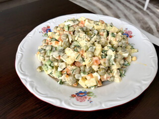 Traditional Russian Salad in Plate. Ready to Serve and Eat.