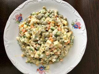 Traditional Russian Salad in Plate. Ready to Serve and Eat.