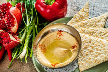 Fresh bowl of homemade hummus with vegetables