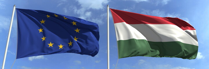 Waving flags of the European Union and Hungary on flagpoles, 3d rendering