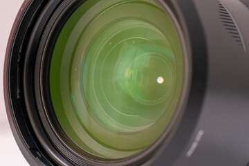 Camera lens close up with green reflection round blades