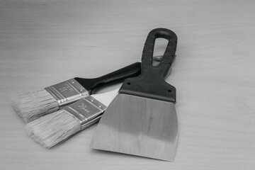 Tool for painting work. Spatula and brushes. Set of items for repair. Top view of a builder with a...
