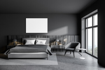 Gray bedroom with poster and armchair