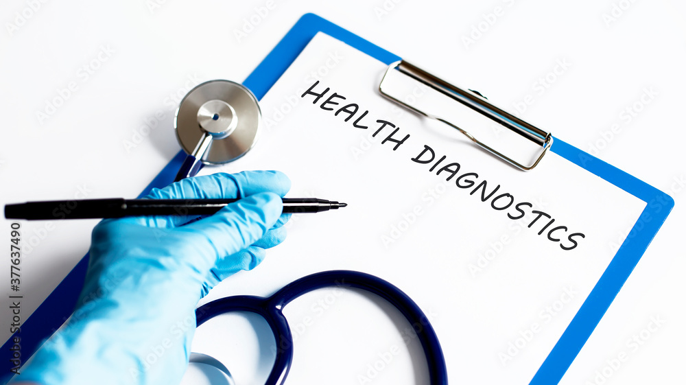 Poster paper with text health diagnostics on a table with stethoscope
