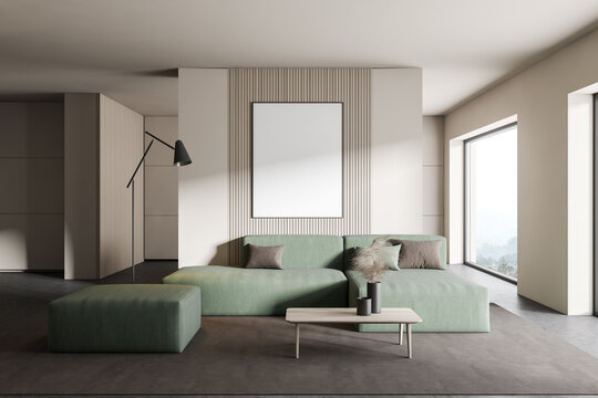 White living room with green sofa and poster