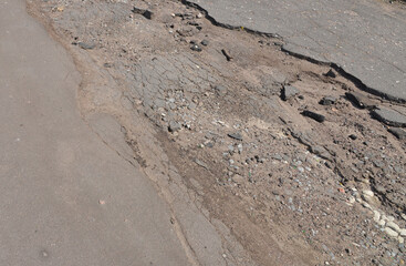 Old black asphalt close up.