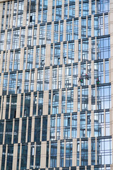 Window cleaners on the facade of a skyscraper