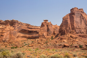 Fototapeta premium Crumbling rock formations and rocks falling down into Arches National Park, Utah. Typical view of the crumbling rock of sandstone
