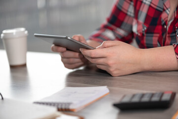 Female hands using digital tablet