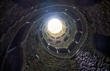 The Initiation Wells (Inverted tower) in Quinta da Regaleira estate. Sintra. Portugal - obrazy, fototapety, plakaty