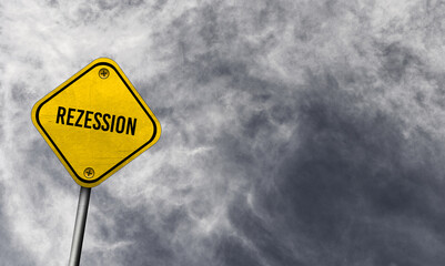 Yellow rezession sign with cloudy background