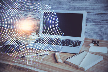 Double exposure of work space with computer and human brain drawing hologram. Brainstorm concept.