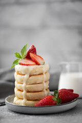 cottage cheese pancakes with fresh strawberries, mint and milk