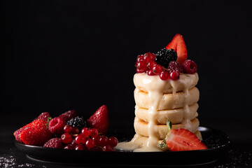 cottage cheese pancakes with fresh berries and condensed milk