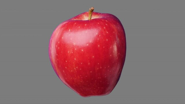 Fresh red apple spin and float - isolated on neutral gray. Seamless loop for unlimited duration. Alpha channel included for compositing projects