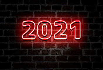 Fototapeta na wymiar 2021 red neon sign text on brick wall, decoration
