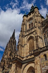 Fototapeta na wymiar The Metropolitan Cathedral of Saints Vitus, Wenceslaus and Adalbert located in Prague Castle Complex. Beautiful Facade of Prague Monument.