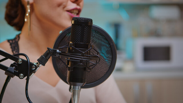 Close up of social media star talking in the microphone. Creative online show presenter, On-air online production internet broadcast show host streaming live content, recording digital social media