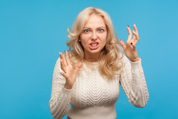 Aggressive stressed blond woman arguing and becoming mad clenching teeth, crazy furious lady in...