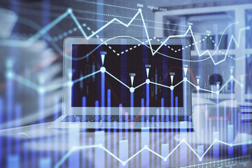 Stock market graph and table with computer background. Multi exposure. Concept of financial analysis.