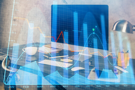 Financial graph colorful drawing and table with computer on background. Double exposure. Concept of international markets.