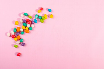 sweet bright colour candies on pink