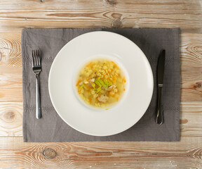 Homemade Noodle Soup with Chicken on Vintage Background