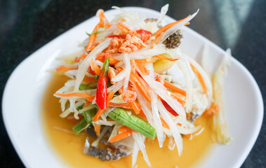 Thai spicy papaya salad with fresh Blue crab
