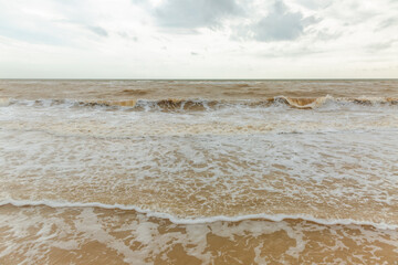 sea landscape with sandy beach and calm waves