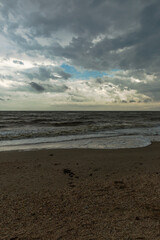 sea landscape with sandy beach and calm waves