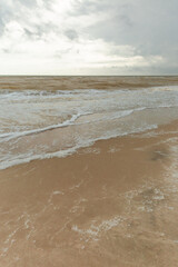 sea landscape with sandy beach and calm waves
