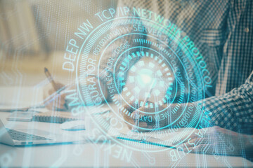 Businessman with computer background with technology theme hologram. Concept of hightech. Multi exposure.