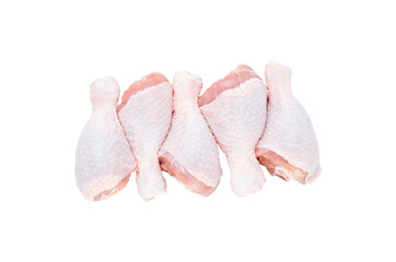 Set of five fresh chicken drumsticks isolated on a white background.