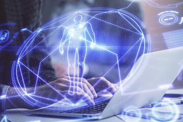 Science hologram with man working on computer on background. Concept of study. Double exposure.