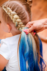 1 blonde girl braids with blue hair, beautiful hairstyle
