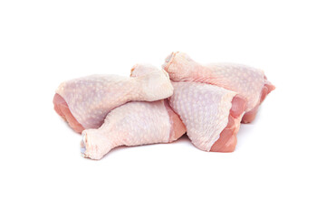 Set of five fresh raw chicken drumsticks on a white background.