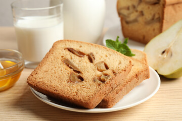 Composition with tasty pear bread on wooden table, closeup. Homemade cake