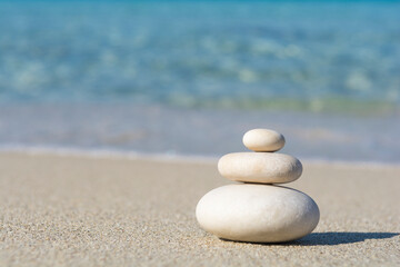 Fototapeta na wymiar Balanced pebbles on a the beach, close up