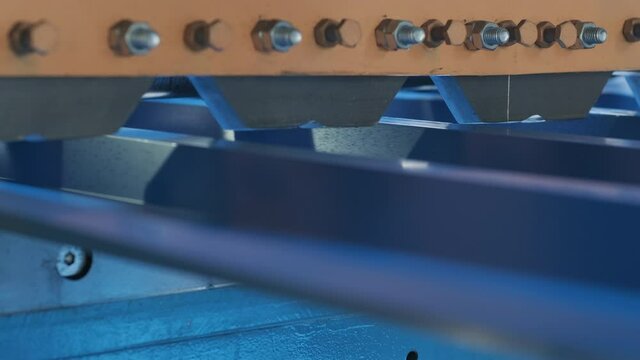 Metal sheet forming machine at the modern metalwork factory.