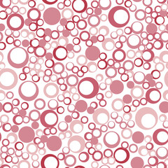 Seamless pattern of repeating pink circles of different sizes. Vector EPS 10