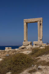 Fototapeta na wymiar Day view of Portara marble gate in Naxos