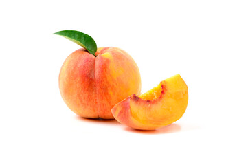 Fresh sweet sliced peach with green leaf isolated on white background.