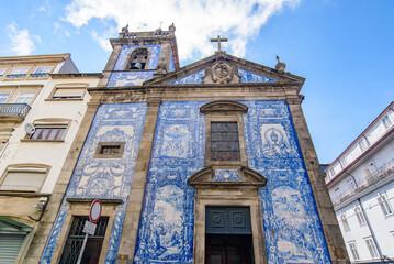 Fototapeta na wymiar Chapel of Souls (Capela das Almas), a church decorated with Azulejo tiles in Porto, Portugal