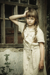 teenage girl on the background of an old wooden window