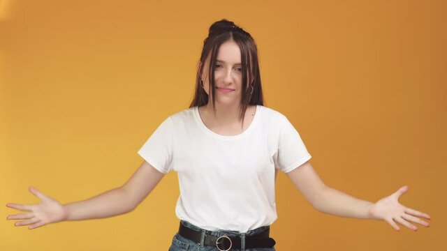 Angree feeling. Offended girl. Annoying woman looking frowningly and proving something. Isolated on orange copy space. Impatience gesture. Stressed situation. Dispute talk